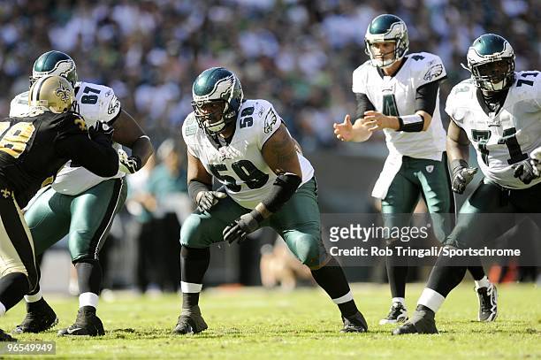 Kevin Kolb of the Philadelphia Eagles waits for the snap as Brent Celek Nick Cole and Jason Peters block against the New Orleans Saints at Lincoln...