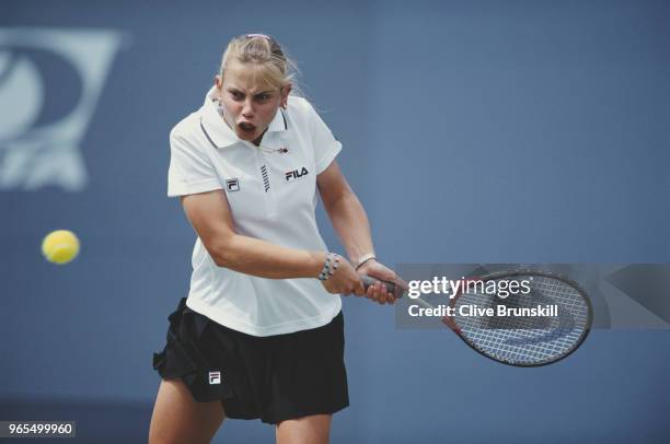 Jelena Dokic of Australia returns the ball to Arantxa Sanchez-Vicario during their Women's Singles match of the US Open Tennis Championship on 30...