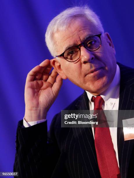 David Rubenstein, founder and managing director of the Carlyle Group, gestures while speaking at the Super Return International 2010 conference in...