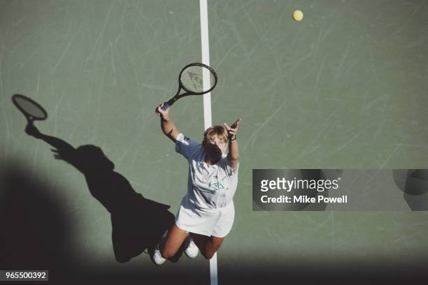 Steffi Graf of Germany serves to Gabriela Sabatini during their Women's Singles Final match of the US Open Tennis Championship on 10 September 1988...