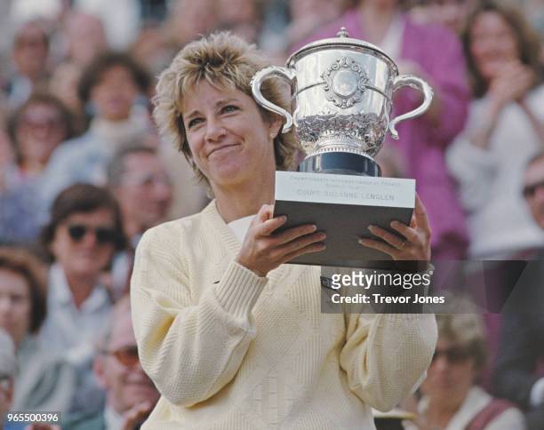 Chris Evert of the United States holds the Suzanne-Lenglen Cup after her victory over defending champion Martina Navratilova during their Women's...