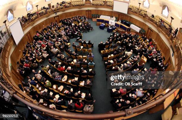 Members of the General Synod listen as the Archbishop of Canterbury, Dr Rowan Williams, delivers Holy Communion at the beginning of the third day of...