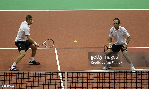 Simon Aspelin of Sweden and Paul Hanley of Australia in action in their doubles match against Simon Bolelli and Andreas Seppi of Italy during day...