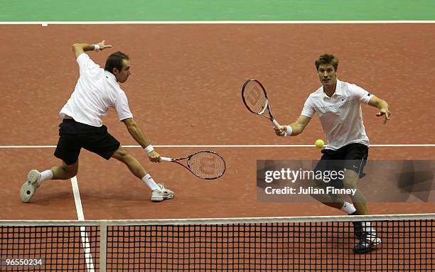 Simon Aspelin of Sweden and Paul Hanley of Australia in action in their doubles match against Simon Bolelli and Andreas Seppi of Italy during day...