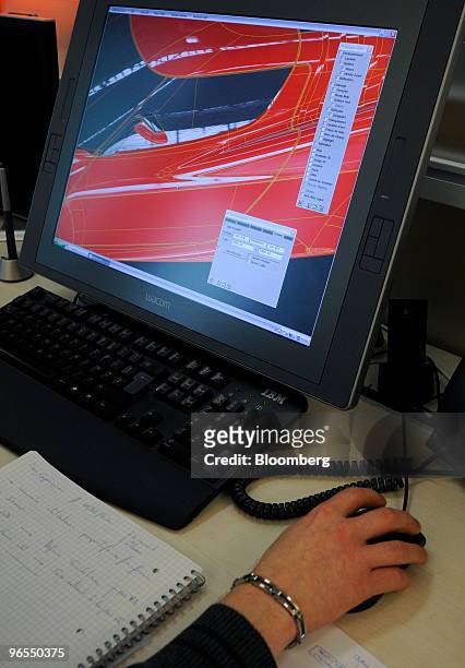 Sebastien Smetryns, a Dassault Systemes 3-D designer, uses the 3-D design software ICEM to design a car at the company's headquarters in Velizy, near...