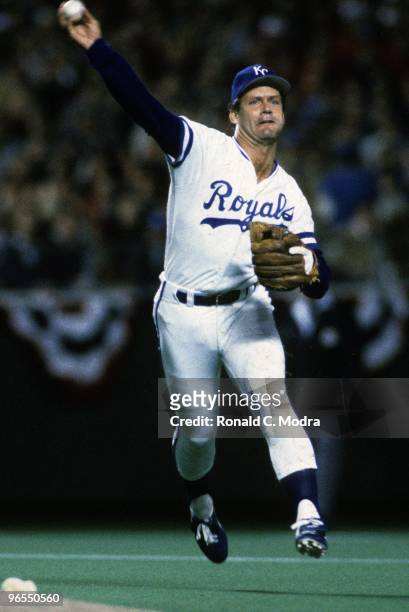 George Brett of the Kansas City Royals throws to first base during Game 1 of the 1985 World Series against the St. Louis Cardinals at Royals Stadium...