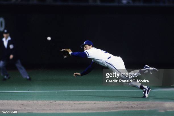 George Brett of the Kansas City Royals fields a ball during Game 7 of the1985 World Series against the St. Louis Cardinals at Royals Stadium on...