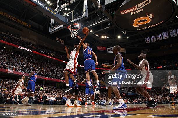 Rafer Alston of the Miami Heat lays up a shot against Daniel Green of the Cleveland Cavaliers during the game on February 4, 2010 at Quicken Loans...