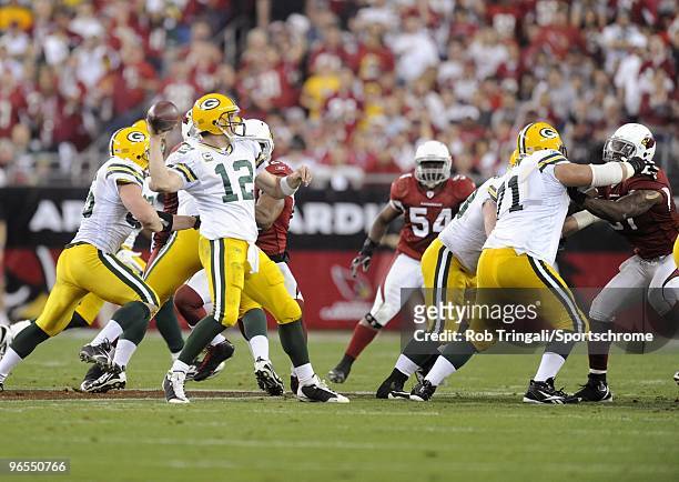 Aaron Rodgers of the Green Bay Packers passes in the fourth quarter against the Arizona Cardinals in the NFC wild-card playoff game at University of...