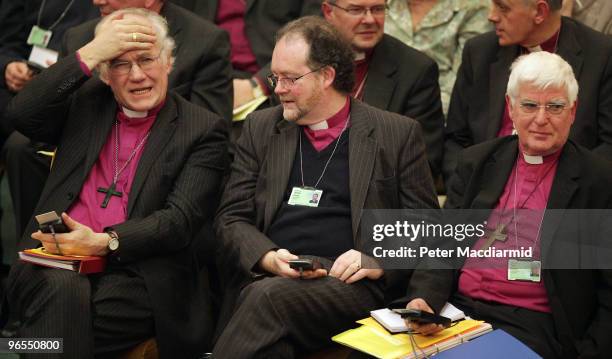 The Bishop of Chester Peter Forster , The Bishop of Liverpool James Jones and The Bishop of Southwark Tom Butler try to vote using an electronic key...