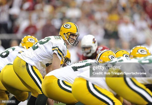 Aaron Rodgers of the Green Bay Packers before the snap against the Arizona Cardinals in the NFC wild-card playoff game at University of Phoenix...