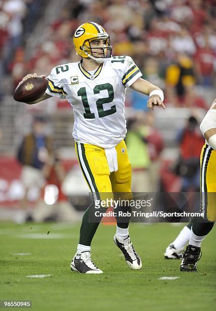 Aaron Rodgers of the Green Bay Packers passes against the Arizona Cardinals in the NFC wild-card playoff game at University of Phoenix Stadium on...