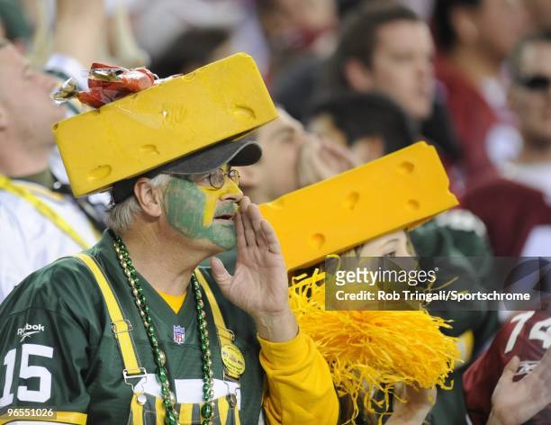 Fans of the Green Bay Packers with cheese heads look on against the Arizona Cardinals in the NFC wild-card playoff game at University of Phoenix...