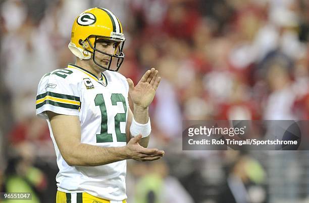 Aaron Rodgers of the Green Bay Packers against the Arizona Cardinals in the NFC wild-card playoff game at University of Phoenix Stadium on January...