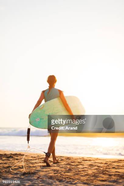 young surfer woman - puerto escondido stock pictures, royalty-free photos & images