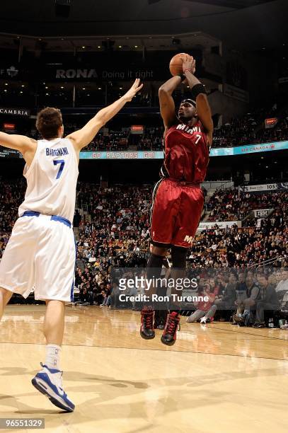 Jermaine O'Neal of the Miami Heat shoots against Andrea Bargnani of the Toronto Raptors during the game on January 27, 2010 at Air Canada Centre in...