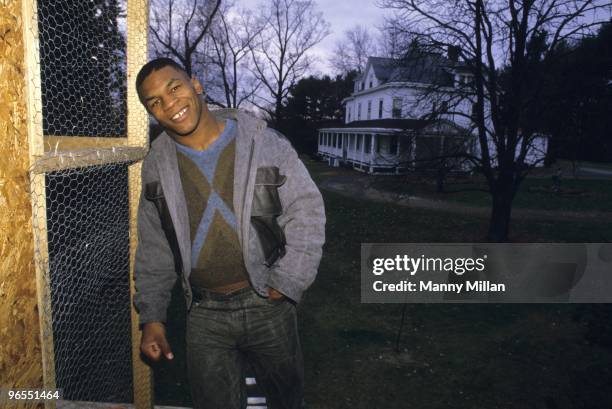 Casual portrait of Mike Tyson outside of his pigeons in coup at the home of his surrogate mother Camille Ewald. Catskill, NY 12/1/1985 CREDIT: Manny...