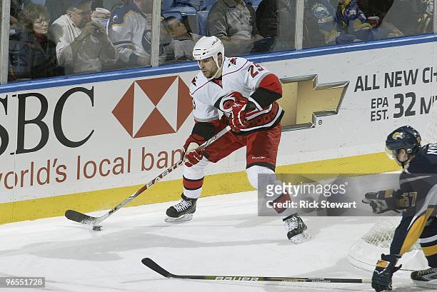 Tom Kostopoulos of the Carolina Hurricanes handles the puck during the game against the Buffalo Sabres at HSBC Arena on February 5, 2010 in Buffalo,...