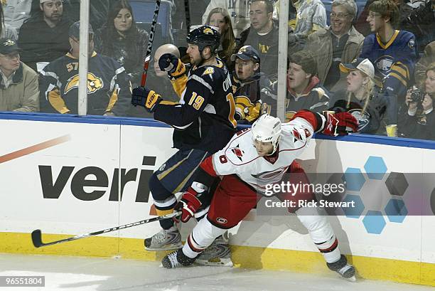 Tim Gleason of the Carolina Hurricanes collides with Tim Connolly of the Buffalo Sabres at HSBC Arena on February 5, 2010 in Buffalo, New York.