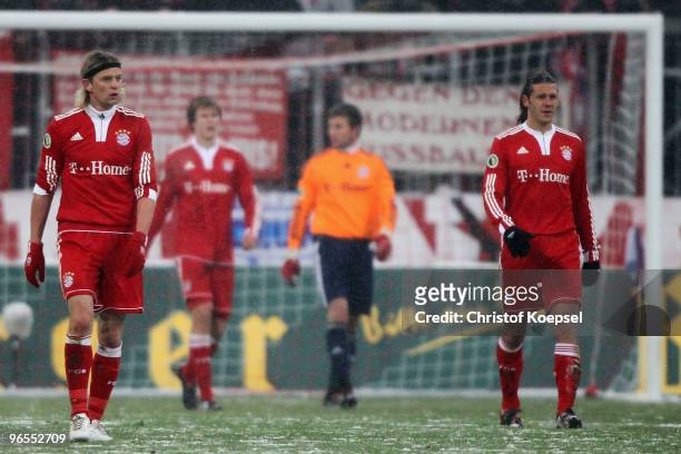 Anatoly Tymoshchuk, Holger Badstuber, Michael Rensing and Martin Demichelis of Bayern look dejected after the second goal of Fuerth during the DFB...