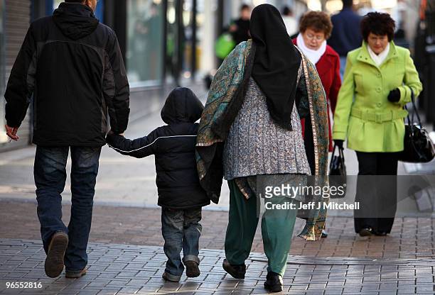 Members of the public walk through Kirkcaldy town centre in the constituency of Gordon Brown British prime minister on February 10, 2010 in...