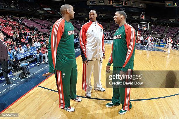 Michael Redd and Charlie Bell of the Milwaukee Bucks talk with Bobby Simmons of the New Jersey Nets before the game on January 5, 2010 at the Izod...