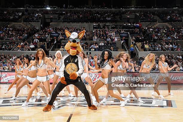 The San Antonio Spurs mascot Coyote performs with the dance team during the game against the Houston Rockets on January 22, 2010 at the AT&T Center...