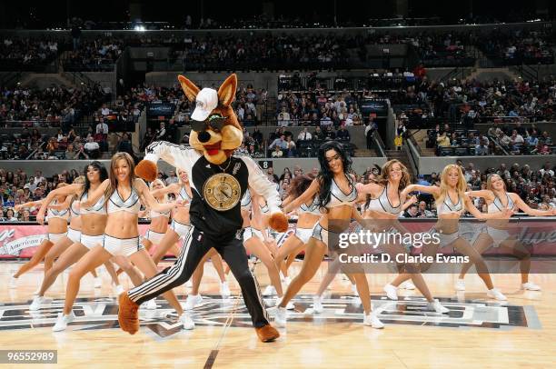 The San Antonio Spurs mascot Coyote performs with the dance team during the game against the Houston Rockets on January 22, 2010 at the AT&T Center...