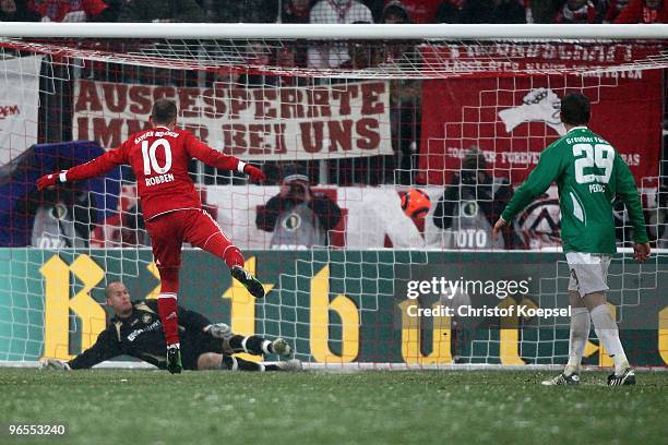 Arjen Robben of Bayern scores the second goal by penalty against goalkeeper Stephan Loboue of Greuther Fuerth during the DFB Cup quarter final match...