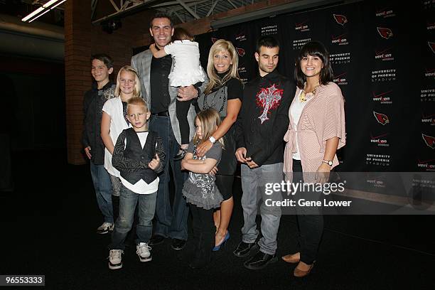 Arizona Cardinals quarterback Kurt Warner announces his retirement and poses for photos with his wife Brenda Warner and family afterwards at the...