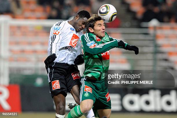 Saint-Etienne's Argentinian forward Gonzalo Ruben Bergessio vies with Vannes' Cameroonian midfielder Valery Mezague during their French Cup football...