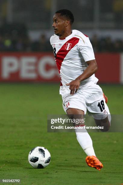 Andre Carrillo of Peru drives the ball during the international friendly match between Peru and Scotland at Estadio Nacional de Lima on May 29, 2018...