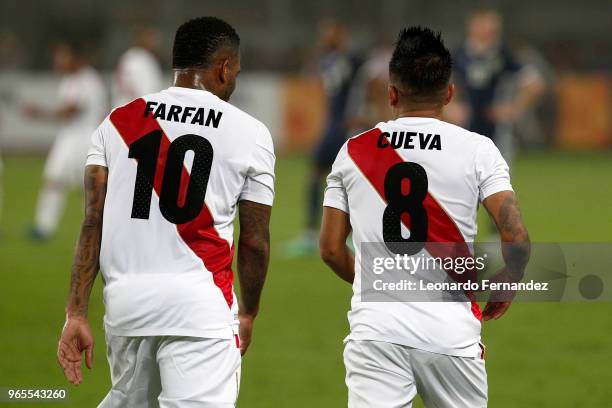 Jefferson Farfan and Christian Cueva of Peru look on during the international friendly match between Peru and Scotland at Estadio Nacional de Lima on...