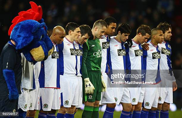 Blackburn Rovers players pay their respects to John Taylor during a minutes silence, after he died at the Stoke versus Blackburn Rovers game during...