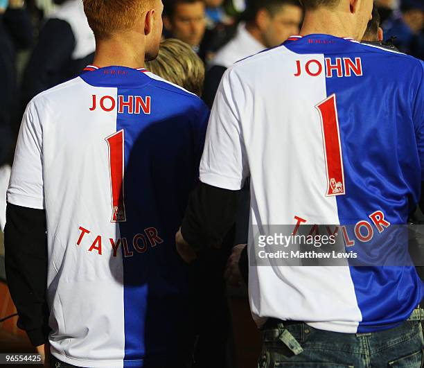 The family of John Taylor lwear shirts in his memory during a minutes silence, after he died at the Stoke versus Blackburn Rovers game during the...