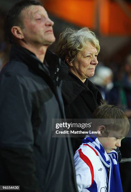 The family of John Taylor look on during a minutes silence, after he died at the Stoke versus Blackburn Rovers game during the Barclays Premier...