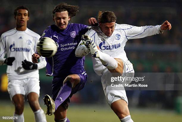 Henrich Bencik of Osnabruck and Marcelo Bordon of Schalke battle for the ball during the DFB Cup quarter final match between VfL Osnabrueck and FC...