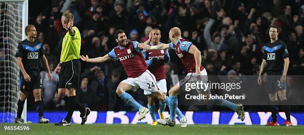 Carlos Cuellar of Aston Villa celebrates scoring their first goal during the FA Barclays Premier League match between Aston Villa and Manchester...