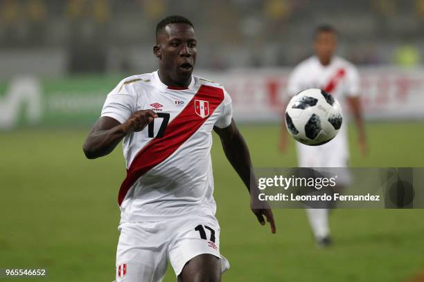 Luis Advincula of Peru looks the ball during the international friendly match between Peru and Scotland at Estadio Nacional de Lima on May 29, 2018...