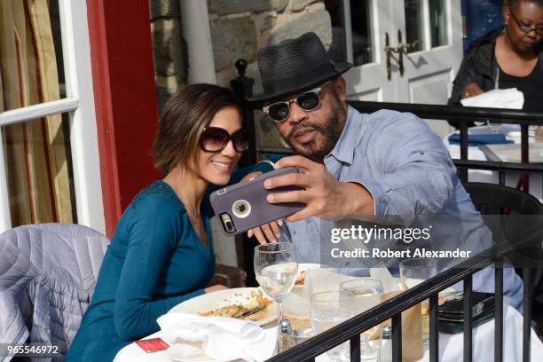 Couple takes a 'selfie' photograph after eating at a restaurant in the Old Town section of Alexandria, Virginia.