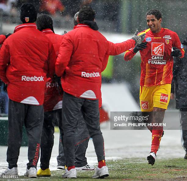 Lens's Tunisian forward Issam Jemaa celebrates after scoring a goal during their French Cup football match Lens vs Marseille on February 10, 2010 at...
