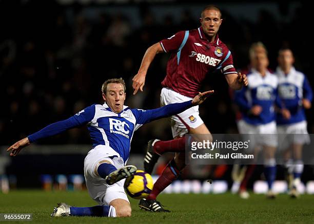 Lee Bowyer of Birmingham City battles for the ball with Matthew Upson of West Ham United during the Barclays Premier League match between West Ham...