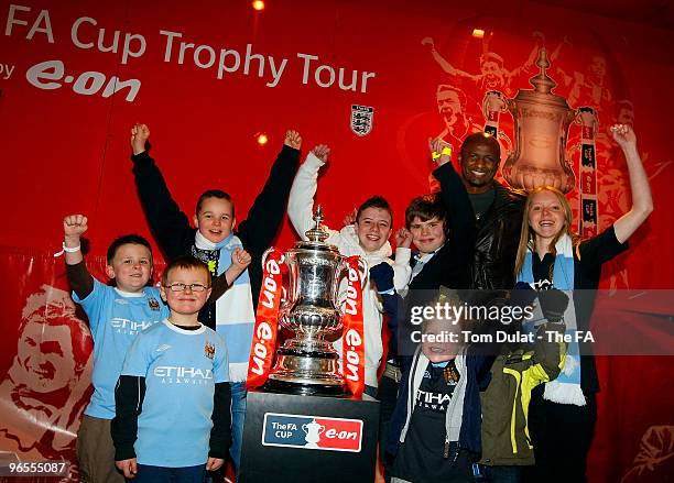 Patrick Vieira and kids pose with the FA Trophy during the FA Cup Trophy Tour at City of Manchester Stadium on February 10, 2010 in Manchester,...