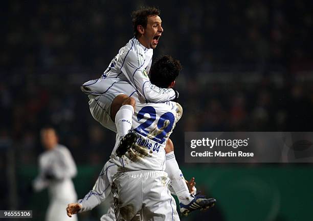 Kevin Kuranyi of Schalke celebrate with team mate Rafinha after he scores his team's 1st goal during the DFB Cup quarter final match between VfL...