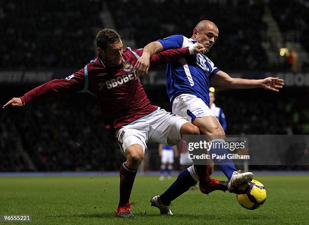 Alessandro Diamanti of West Ham United battles for the ball with Stephen Carr of Birmingham City during the Barclays Premier League match between...