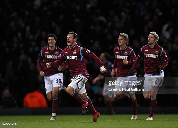 Alessandro Diamanti of West Ham United celebrates with his team-mates after scoring the first goal for West Ham United during the Barclays Premier...