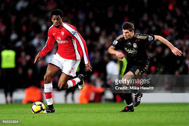 Abou Diaby of Arsenal gets past Steven Gerrard of Liverpool during the Barclays Premier League match between Arsenal and Liverpool at Emirates...