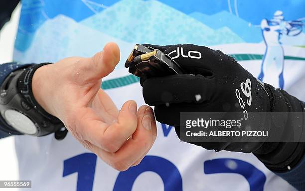 Franc's Sylvie Becourt loads .22 caliber bullets into magazines during the women's Biathlon training in Whistler Olympic Park in preparation for the...