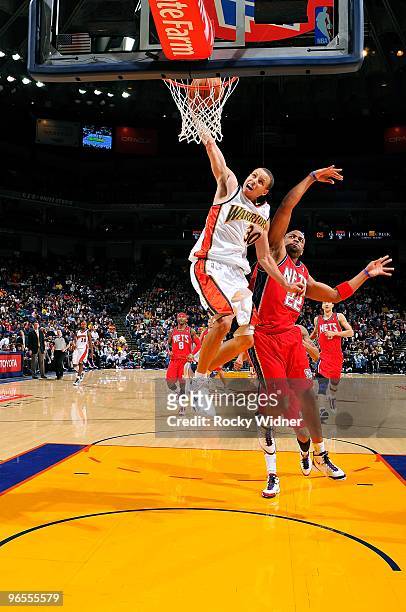 Stephen Curry of the Golden State Warriors puts up a shot against Jarvis Hayes of the New Jersey Nets during the game on January 22, 2010 at Oracle...