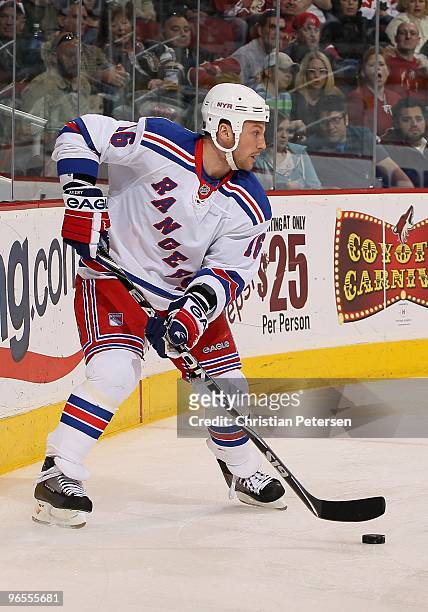 Sean Avery of the New York Rangers skates with the puck during the NHL game against the Phoenix Coyotes at Jobing.com Arena on January 30, 2010 in...